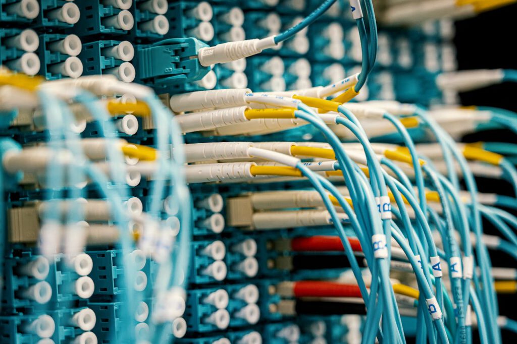 pexels-photo-4280702 Industrial optical switch with connected rubber cables of different colors with stickers representing letters and numbers and plastic terminations