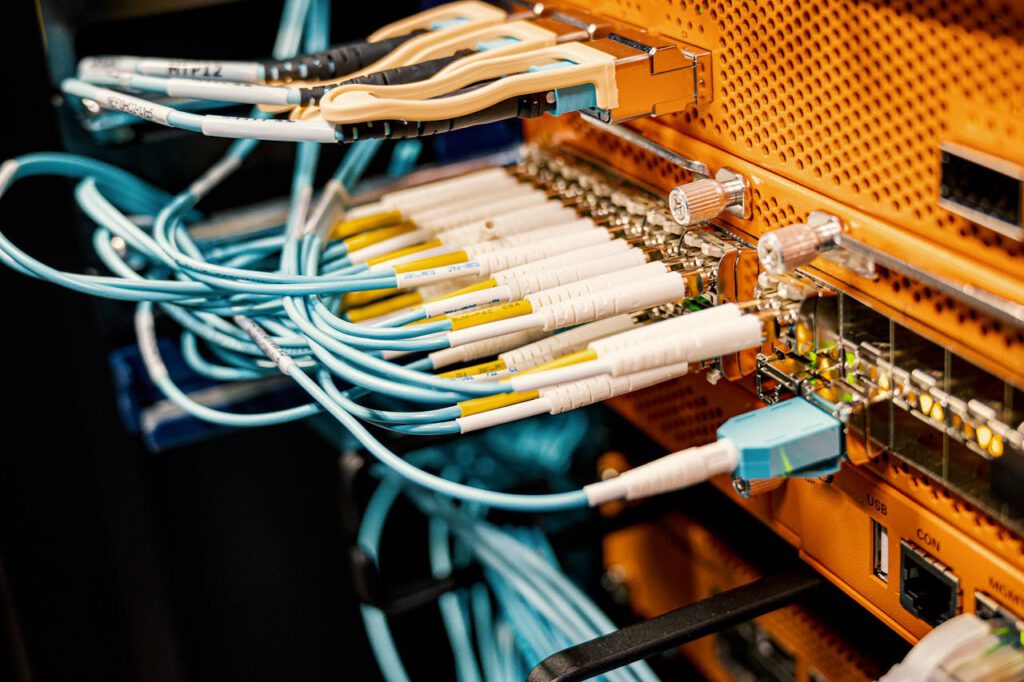 pexels-photo-4508748 Modern hardware and structured cabling system with patch cords inserted into patch panel outlets